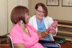 rehab therapist with a resident at Primrose Post-Acute