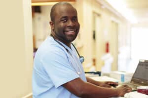 A nurse in the hallway at Primrose Post-Acute