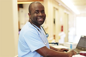 A nurse in the hallway at Primrose Post-Acute