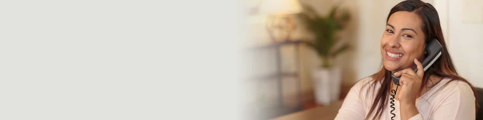 A receptionist on the phone at Primrose Post-Acute